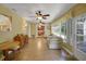 Bright sun room with lots of natural light. Door to backyard allows for easy outdoor access at 2766 Privada Dr, The Villages, FL 32162