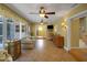 Spacious sun room with tiled floors, ample natural light and backyard views, featuring comfortable seating at 2766 Privada Dr, The Villages, FL 32162