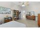 Spacious bedroom with a queen bed, built-in shelving, closet, and access to an ensuite bathroom at 2821 Mediterranean Loop, Tavares, FL 32778