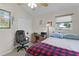 Inviting bedroom with a queen bed, workspace, closet, and a cozy atmosphere at 2821 Mediterranean Loop, Tavares, FL 32778