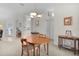 Bright dining room with table and chairs, seamlessly connects to the kitchen and living areas at 2821 Mediterranean Loop, Tavares, FL 32778