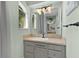 Bathroom vanity features neutral tile countertop and decorative hardware at 2904 Avalos Dr, The Villages, FL 32162