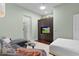Comfortable bedroom featuring a cozy seating area and built-in entertainment center at 2904 Avalos Dr, The Villages, FL 32162