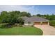 Charming home with mature landscaping and a circular driveway at 2904 Avalos Dr, The Villages, FL 32162