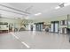 Spacious three car garage with finished floor, storage cabinets, and room for tools and bikes at 2904 Avalos Dr, The Villages, FL 32162