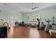 Spacious home gym with hardwood floors, ceiling fans and exercise equipment at 2904 Avalos Dr, The Villages, FL 32162