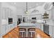 Bright, modern kitchen with white cabinetry, marble countertops, and stainless-steel appliances at 2904 Avalos Dr, The Villages, FL 32162
