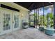 Outdoor lanai with travertine floors, a potting table, and hydroponic planters perfect for gardening at 2904 Avalos Dr, The Villages, FL 32162