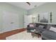 Comfortable living room with soft lighting, a modern sofa, and hardwood floors at 2904 Avalos Dr, The Villages, FL 32162