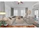 Comfortable living room featuring stylish furniture, neutral tones, and sheer curtains for a bright, airy feel at 2904 Avalos Dr, The Villages, FL 32162