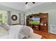 Main bedroom featuring a large entertainment center and access to a printer at 2904 Avalos Dr, The Villages, FL 32162