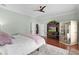 Spacious main bedroom with ensuite sauna, media center, and a ceiling fan at 2904 Avalos Dr, The Villages, FL 32162