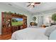 Bright main bedroom featuring a large entertainment center and ample space for a desk at 2904 Avalos Dr, The Villages, FL 32162