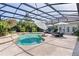 Inviting pool area featuring lush landscaping and ample lounge space at 2904 Avalos Dr, The Villages, FL 32162