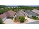 Lovely home with well-maintained lawn, circular driveway, and serene pond view at 2967 Thayer Ter, The Villages, FL 32163