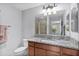 Bathroom vanity features granite counters and leads to private shower at 2967 Thayer Ter, The Villages, FL 32163