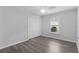 Comfortable bedroom with wood floors, closet, and window offering natural light at 2967 Thayer Ter, The Villages, FL 32163
