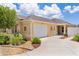 Beautiful home with a two-car garage, mature landscaping, and manicured lawn at 2967 Thayer Ter, The Villages, FL 32163