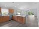 Open-concept kitchen with stainless appliances and seamless flow into living area at 2967 Thayer Ter, The Villages, FL 32163