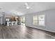 Open living space that joins the kitchen, breakfast bar and outdoor views at 2967 Thayer Ter, The Villages, FL 32163