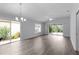 Open living space with lots of natural light and a sliding glass door leading to the outdoors at 2967 Thayer Ter, The Villages, FL 32163