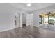 Bright main bedroom featuring a tray ceiling and access to bathroom and lanai at 2967 Thayer Ter, The Villages, FL 32163