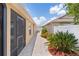 Scenic side yard with brick pavers and lush landscaping at 2967 Thayer Ter, The Villages, FL 32163