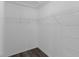 Walk-in closet features ample shelving and wood-look flooring at 2967 Thayer Ter, The Villages, FL 32163