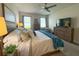 Bedroom featuring neutral colors, ceiling fan, and a picture window at 3181 Hill Point St, Minneola, FL 34715