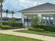 Inviting community pool area with palm trees and comfortable seating, perfect for relaxation at 3181 Hill Point St, Minneola, FL 34715