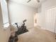 Spare room staged as an exercise room with window and stationary bike at 3181 Hill Point St, Minneola, FL 34715