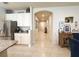 Hallway view highlighting tile flooring, arched entryway, and neutral paint tones at 3181 Hill Point St, Minneola, FL 34715