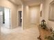 Bright hallway with tile flooring, arched doorways and entry to various rooms at 3181 Hill Point St, Minneola, FL 34715