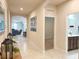 Hallway has tile floors, arched entryways and leads to living spaces and other rooms at 3181 Hill Point St, Minneola, FL 34715