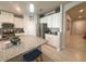 Kitchen featuring granite countertops and stainless steel appliances overlooking dining area at 3181 Hill Point St, Minneola, FL 34715