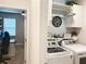 Efficient laundry room featuring modern washer and dryer units at 3181 Hill Point St, Minneola, FL 34715
