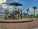 Modern community playground equipment on a cushioned surface, surrounded by a secure fence at 3181 Hill Point St, Minneola, FL 34715