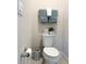 Compact and neat toilet room featuring a toilet, decor and towel rack at 3181 Hill Point St, Minneola, FL 34715