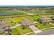 Aerial view of a home with a large lot and a well-manicured lawn in a lakeside community at 3222 San Leo Dr, Orlando, FL 32820