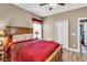 Bedroom featuring a wooden bed frame, wood laminate flooring, and natural light from a window at 3222 San Leo Dr, Orlando, FL 32820