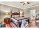 Elegant bedroom features hardwood floors, neutral walls, crown molding, and traditional-style furniture at 3222 San Leo Dr, Orlando, FL 32820