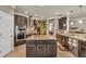 Modern kitchen with stainless steel appliances, granite countertops, and a center island at 3222 San Leo Dr, Orlando, FL 32820