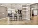 Open-concept area with bar seating, tile floors, with an open view of the dining area and kitchen at 3222 San Leo Dr, Orlando, FL 32820