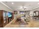 Bright living room with large windows, comfortable seating, and decorative details and tile floors at 3222 San Leo Dr, Orlando, FL 32820