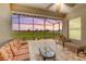 Covered patio with comfortable seating, a coffee table, and view of green space at 3222 San Leo Dr, Orlando, FL 32820