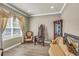 Cozy sitting room featuring stylish furniture, natural light, and wood-look flooring at 3222 San Leo Dr, Orlando, FL 32820