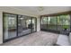 Screened patio with views of the backyard and the indoor living spaces at 33 Palm Dr, Yalaha, FL 34797