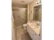 Well-lit bathroom with a walk-in shower, a toilet, and a single sink vanity at 3337 Candlebrook St, The Villages, FL 32162