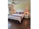 Comfortable bedroom showcasing a neatly made bed with an ornate headboard and neutral colored walls at 3337 Candlebrook St, The Villages, FL 32162