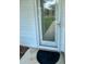 Close-up of home's entrance featuring a black mat at 3337 Candlebrook St, The Villages, FL 32162